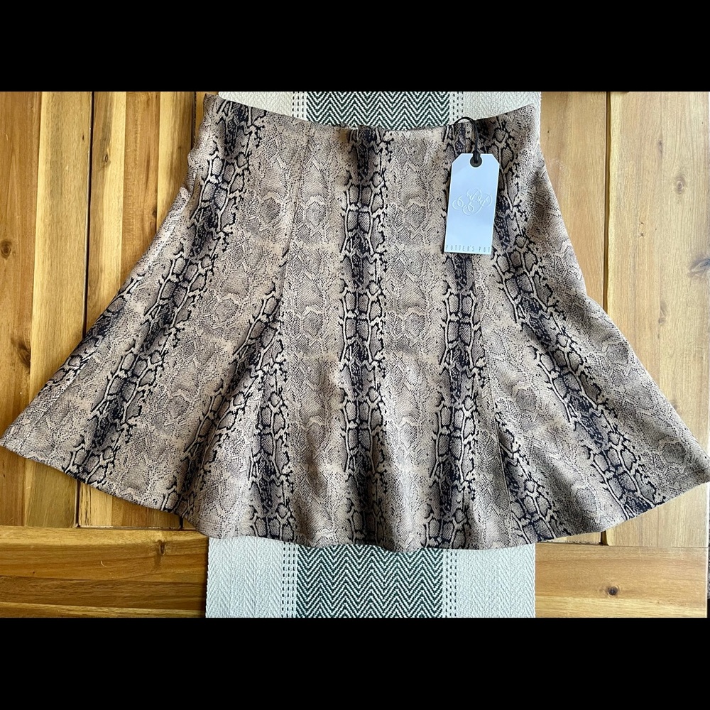 New with tags Potter’s Pot snakeskin skirt. Never worn.